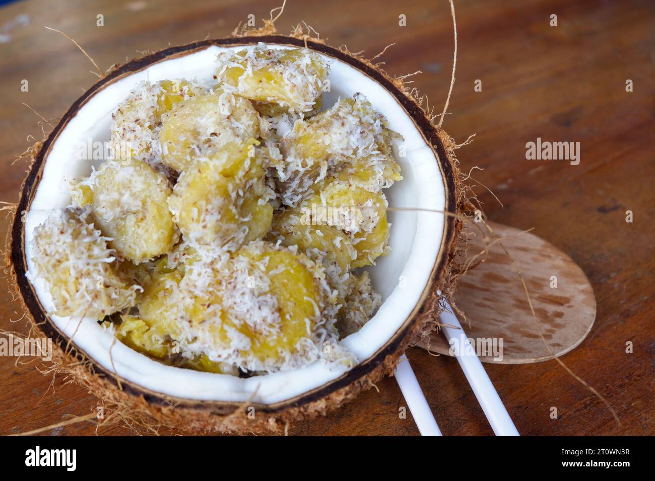 Photos of processed bananas are placed in old coconuts, the concept of the photo is natural Stock Photo