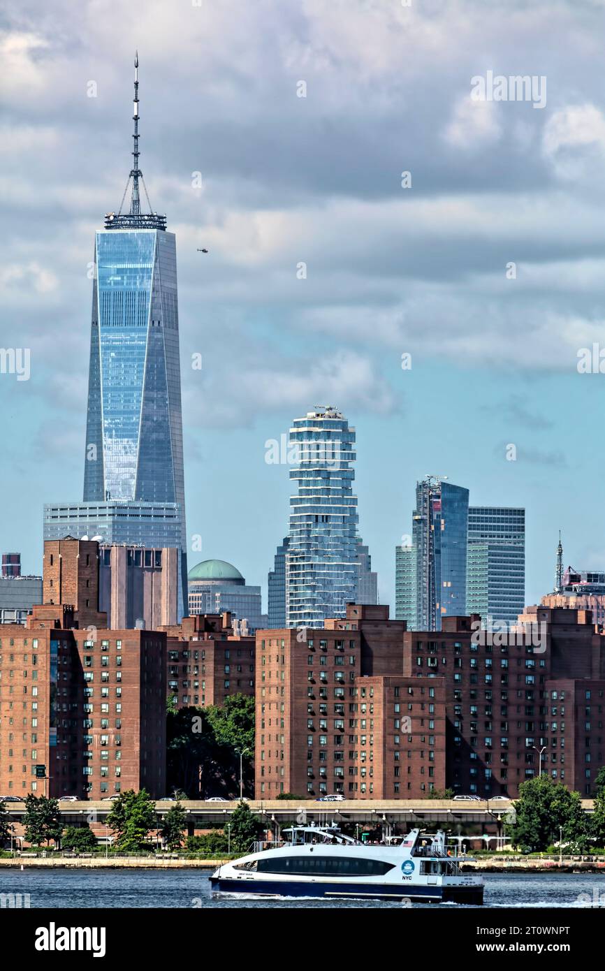 With lower Manhattan as backdrop and East River ferry in foreground ...