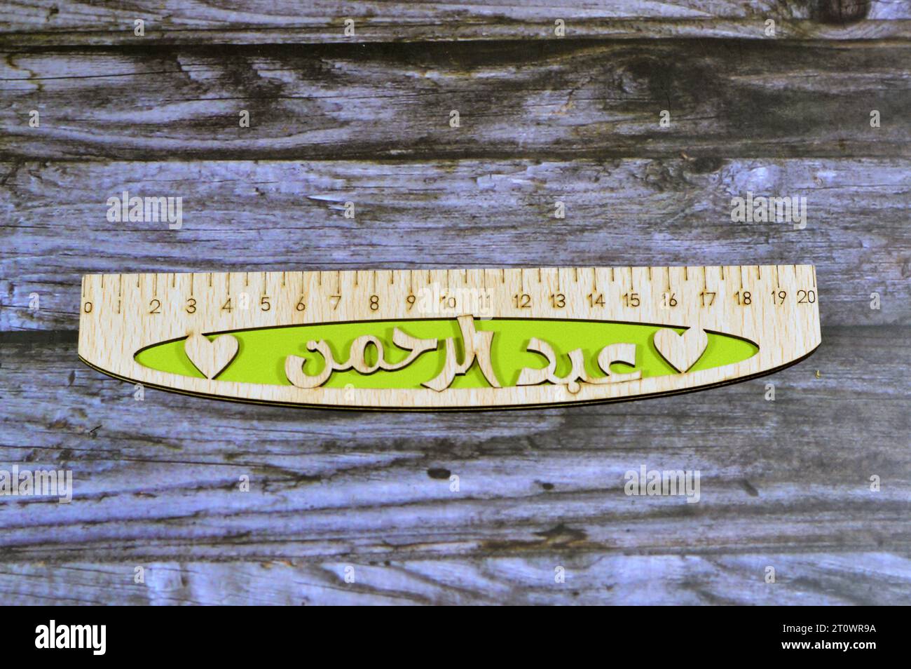 Translation of Arabic name on the ruler (AbdulRahman), Arabian common names on wooden rulers, a rule, line gauge, instrument used to make length measu Stock Photo