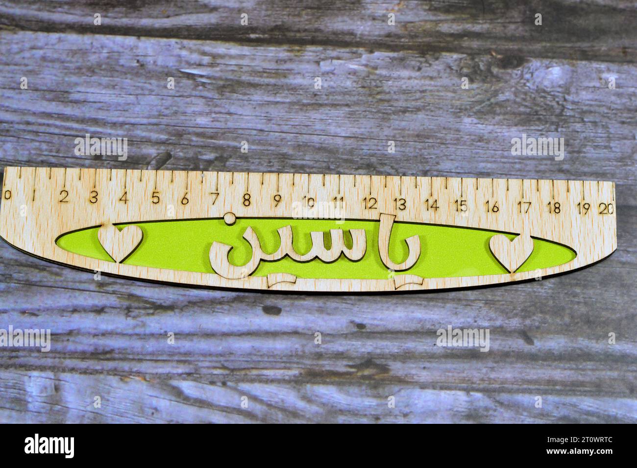 Translation of Arabic name on the ruler (Yassin), Arabian common names on wooden rulers, a rule, line gauge, instrument used to make length measuremen Stock Photo