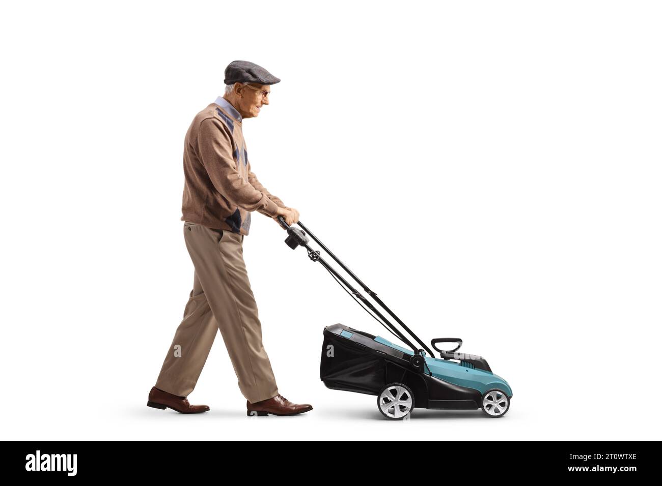 Full length profile shot of an elderly man with a lawnmower machine isolated on white background Stock Photo