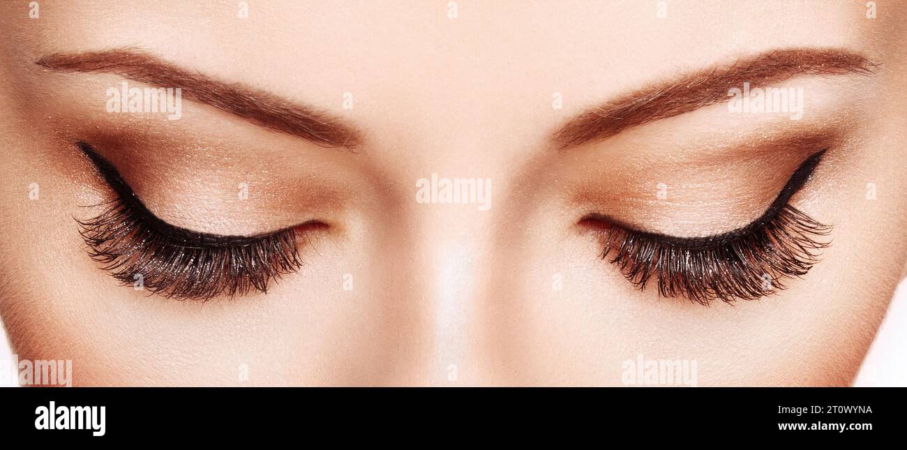 Female Eye with Extreme Long False Eyelashes. Eyelash Extensions. Makeup, Cosmetics, Beauty. Close up, Macro Stock Photo