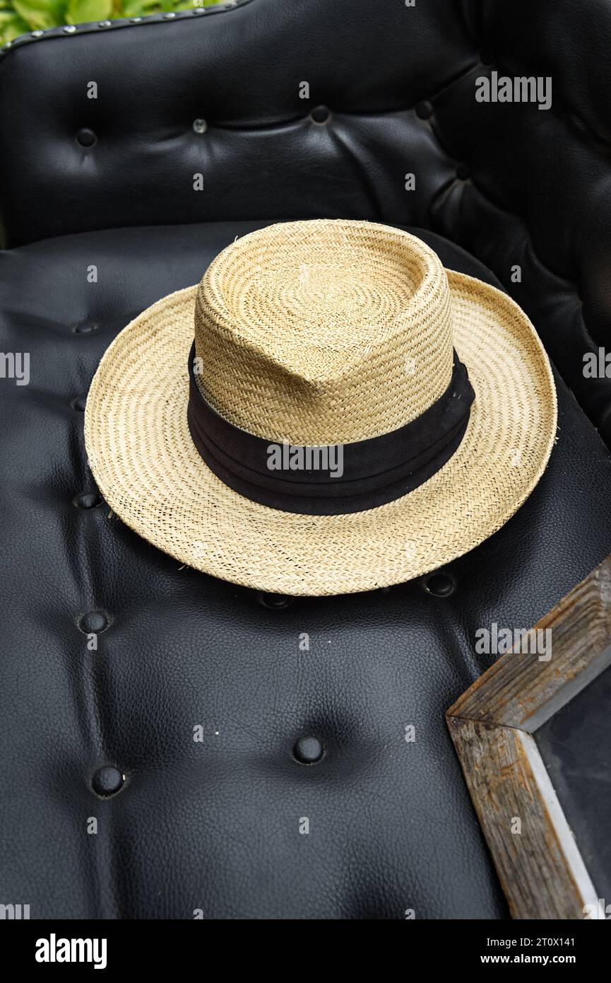 Straw Hat on Seat of Old Car - summer Stock Photo