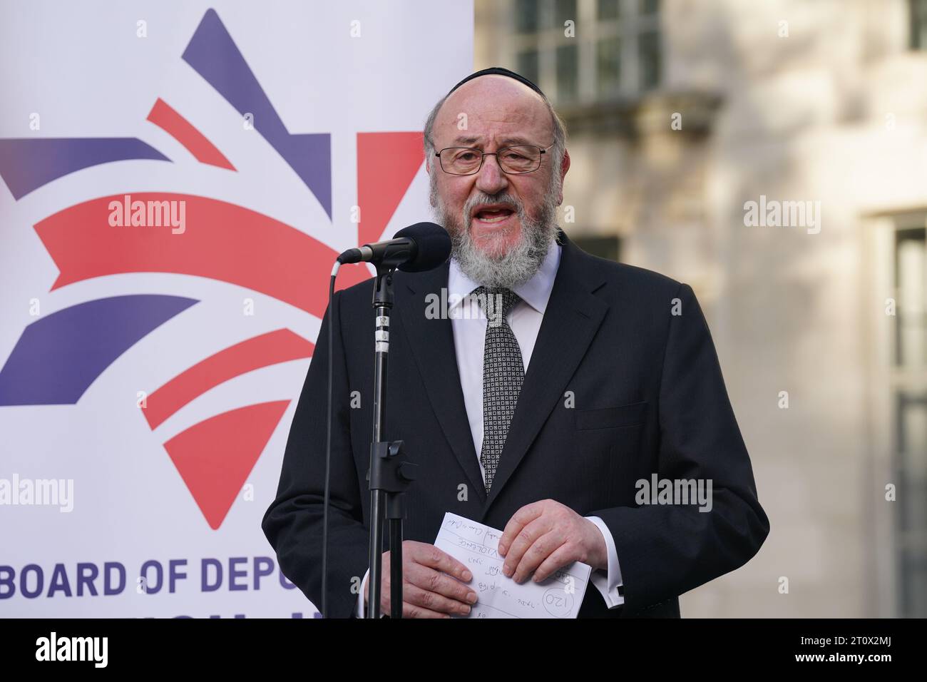 Chief Rabbi Sir Ephraim Mirvis speaking during a vigil outside Downing ...