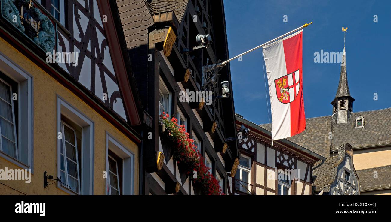 Halftimbered houses and flag with town coat of arms on the market
