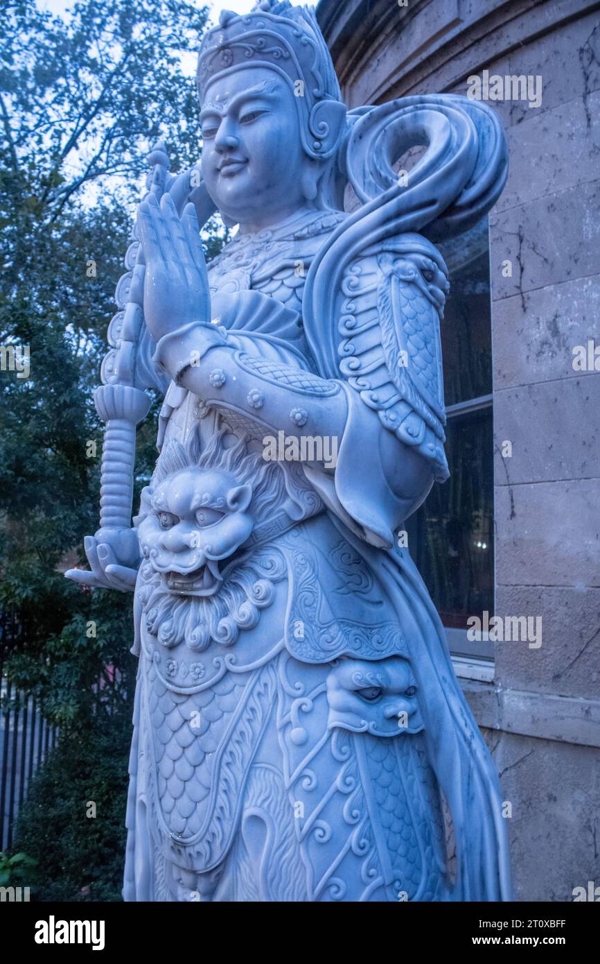 A vertical of a marble statue of Buddha in New York Stock Photo Alamy