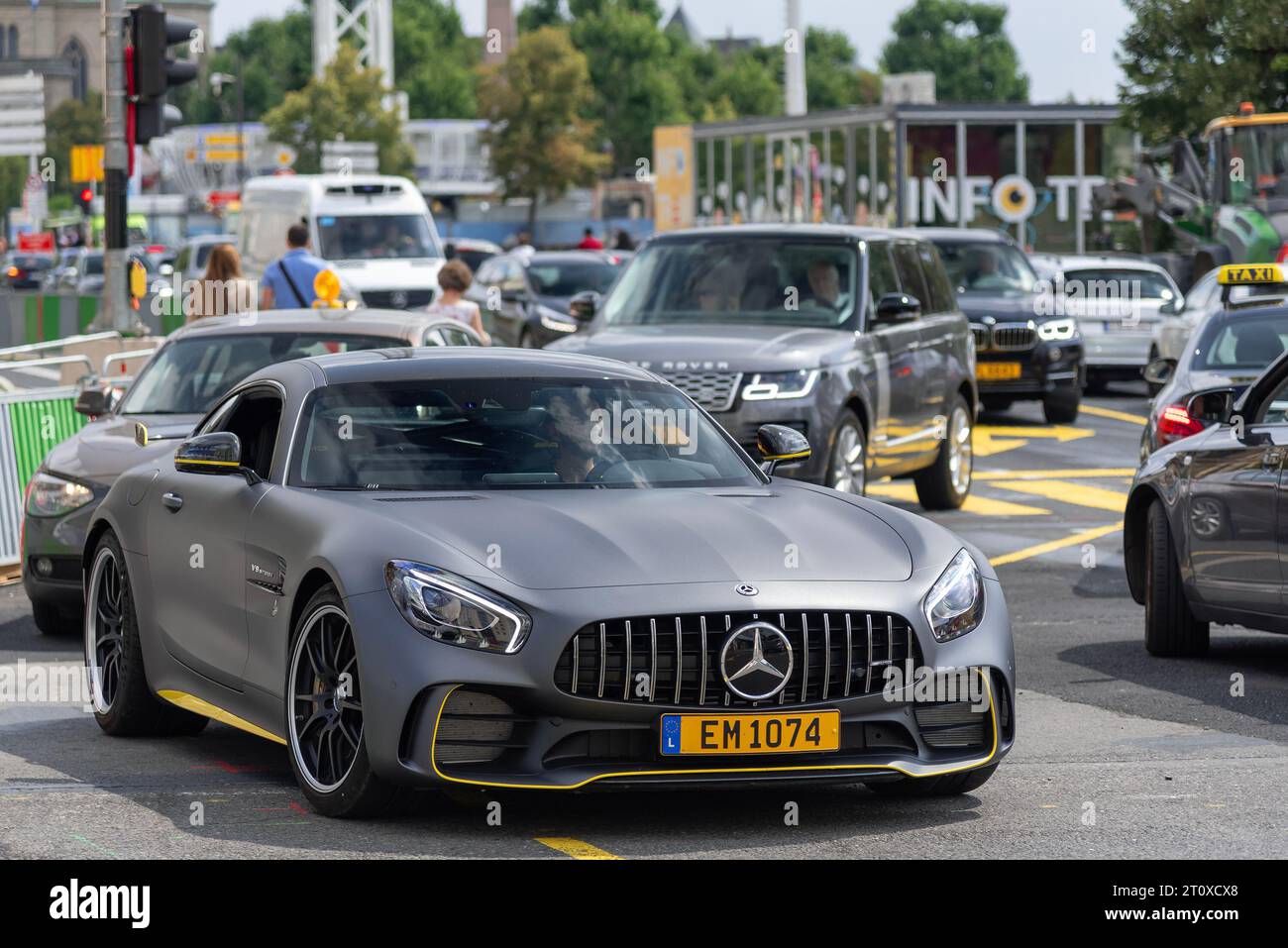 Grey Mercedes-AMG GT R driving on the road Stock Photo