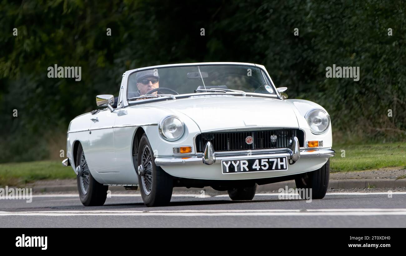 Bicester,Oxon.,UK - Oct 8th 2023:  1970 white MGB classic car driving on an English country road. Stock Photo