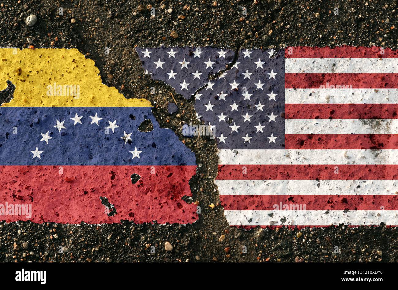 On the pavement are images of the flags of Venezuela and the United States, as a symbol of confrontation. Conceptual image. Stock Photo