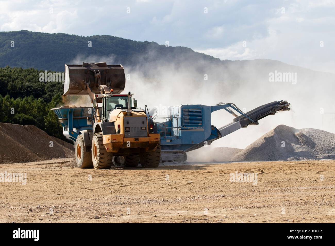 Working machine on the stone quarry site Stock Photo