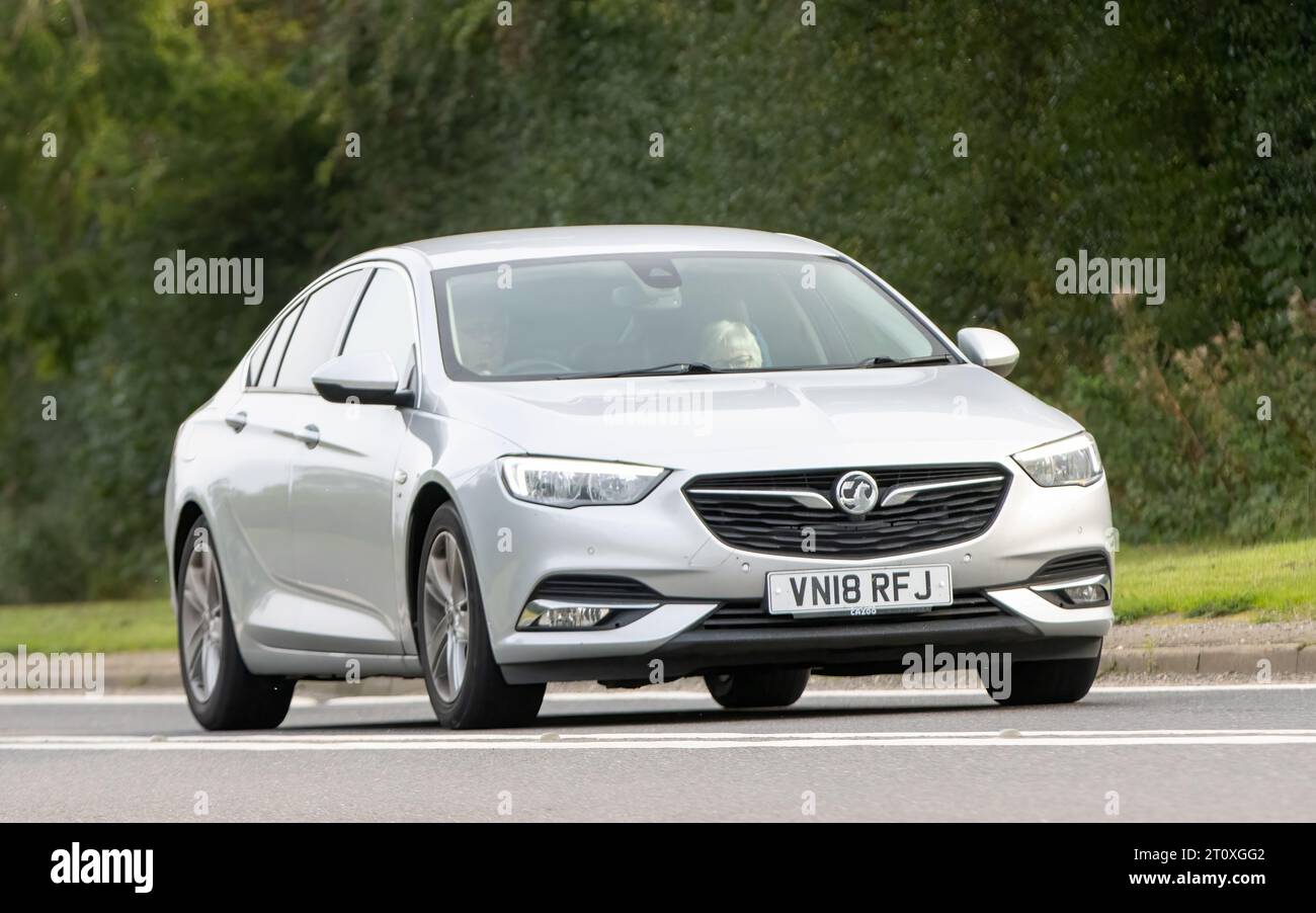 Bicester,Oxon.,UK - Oct 8th 2023: 2018 silver diesel engine Vauxhall Insignia classic car driving on an English country road. Stock Photo