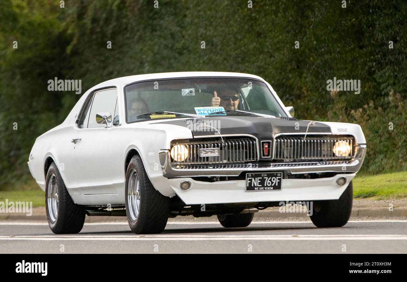Bicester,Oxon.,UK - Oct 8th 2023:  1968 white FORD MERCURY classic car driving on an English country road. Stock Photo