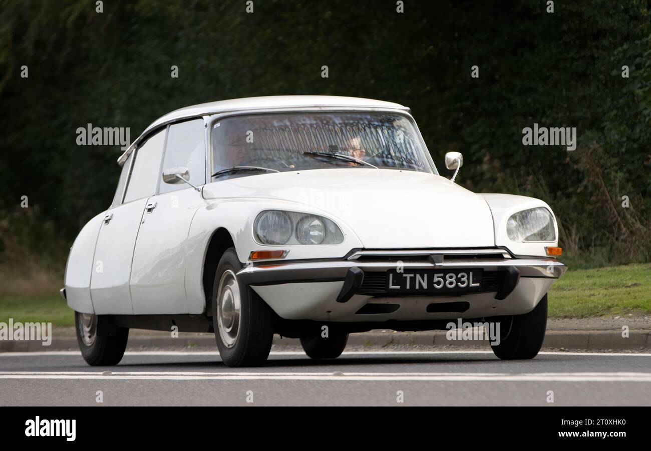 Bicester,Oxon.,UK - Oct 8th 2023: 1972 white Citroen DS classic car driving on an English country road. Stock Photo
