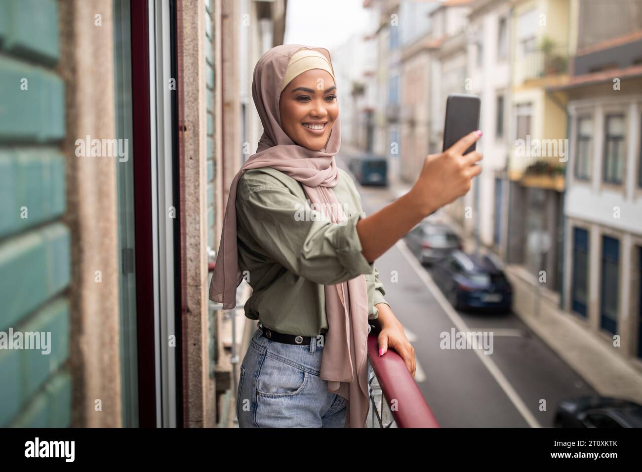 Woman in hijab making video hi-res stock photography and images - Alamy