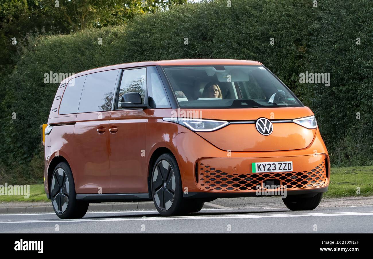 Bicester,Oxon.,UK - Oct 8th 2023:  2023 orange VOLKSWAGEN ID BUZZ 1ST EDITION electric car driving on an English country road. Stock Photo