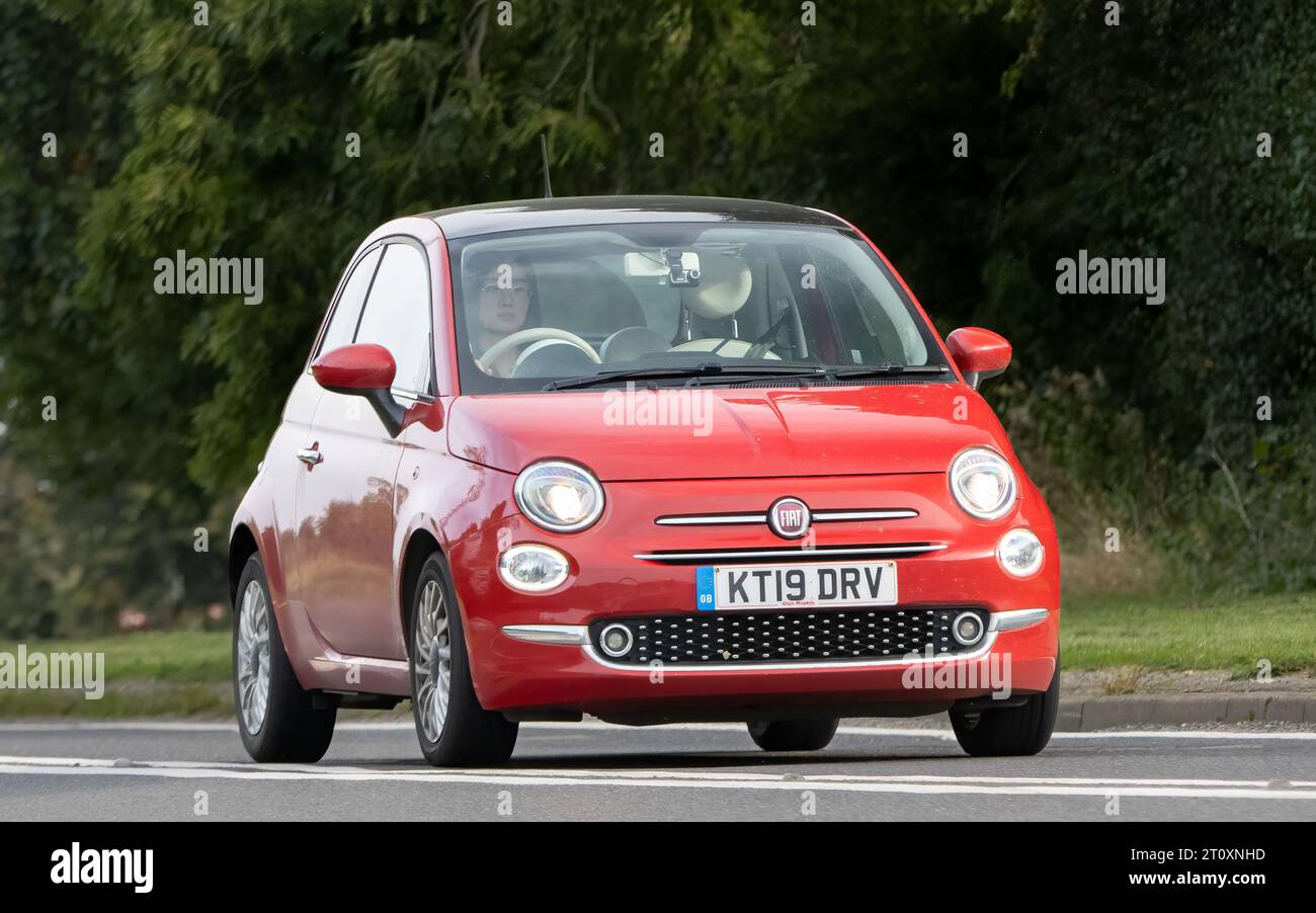 Bicester,Oxon.,UK - Oct 8th 2023: 2019 red Fiat 500 classic car driving on an English country road. Stock Photo