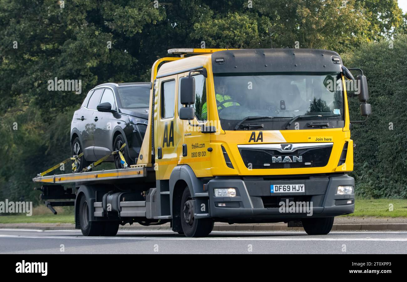 Bicester,Oxon.,UK - Oct 8th 2023:  AA car transporter. Roadside breakdown recovery truck driving on an English country road. Stock Photo