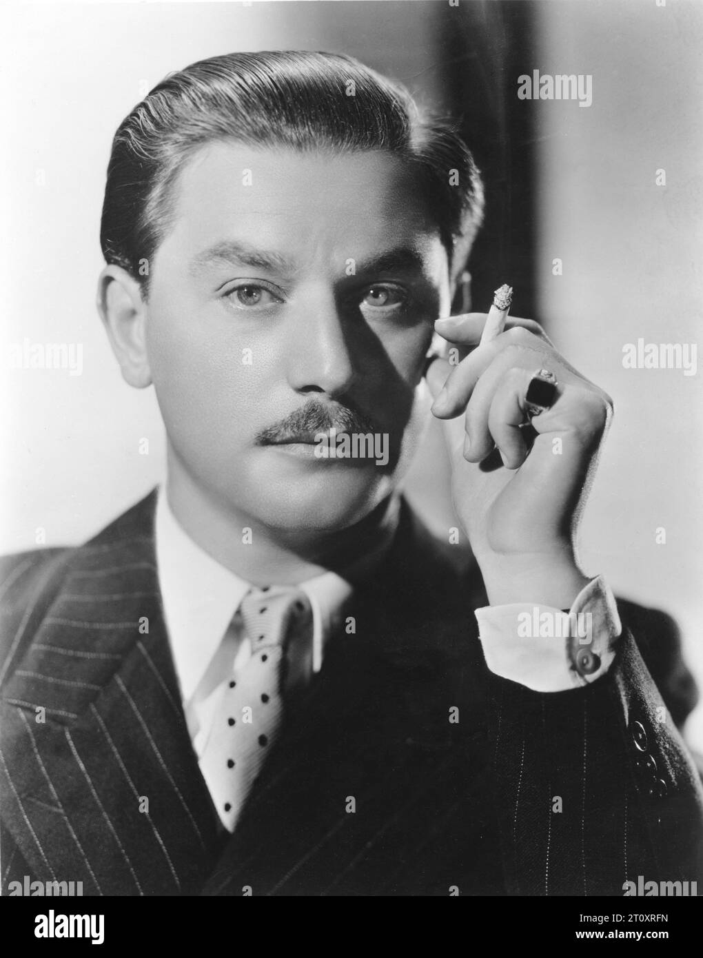 ANTON WALBROOK Portrait holding a cigarette taken in Hollywood in 1937 by Photographer ERNEST A. BACHRACH for RKO Radio Pictures Stock Photo
