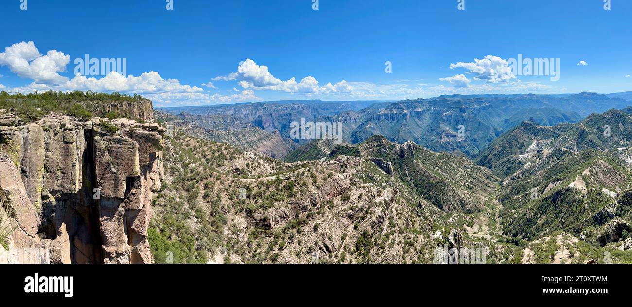 An expansive panoramic shot capturing the majestic Copper Canyon from El Divisadero Station in Chihuahua, Mexico, displaying the canyon's intricate ne Stock Photo