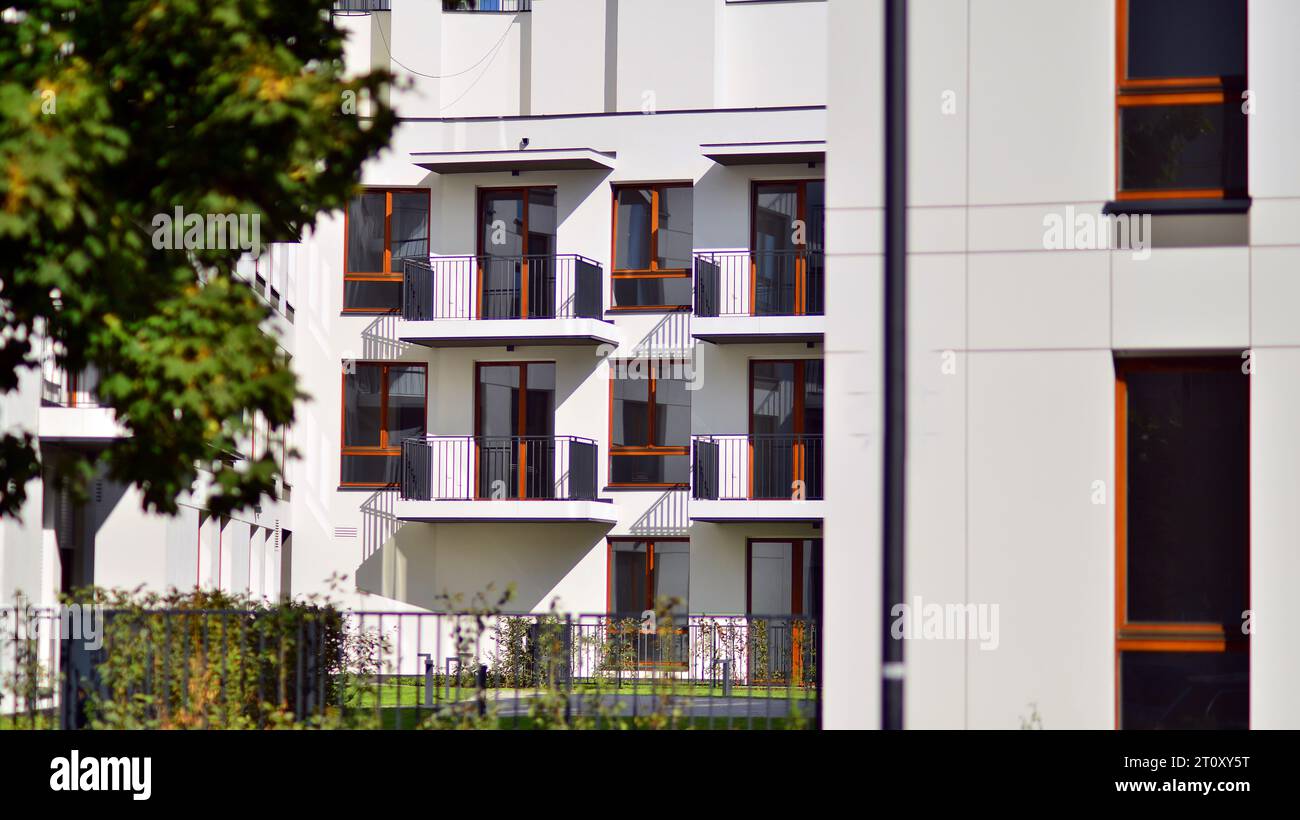 Image showcasing Green community. Eco apartment building saving energy and fresh air ...