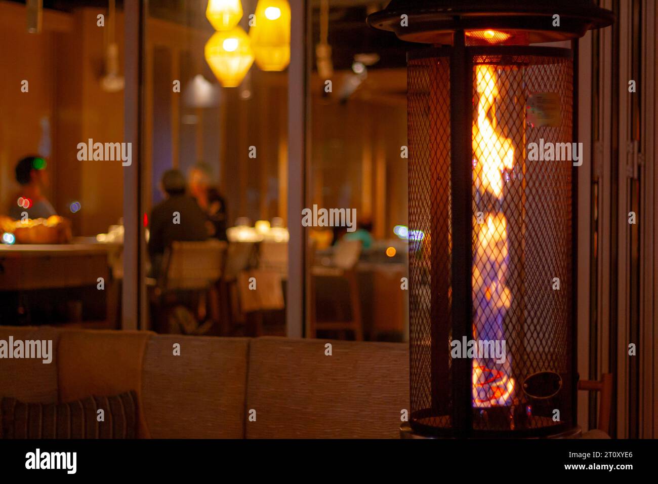 Patio heater or heating lamp outside a restaurant Stock Photo