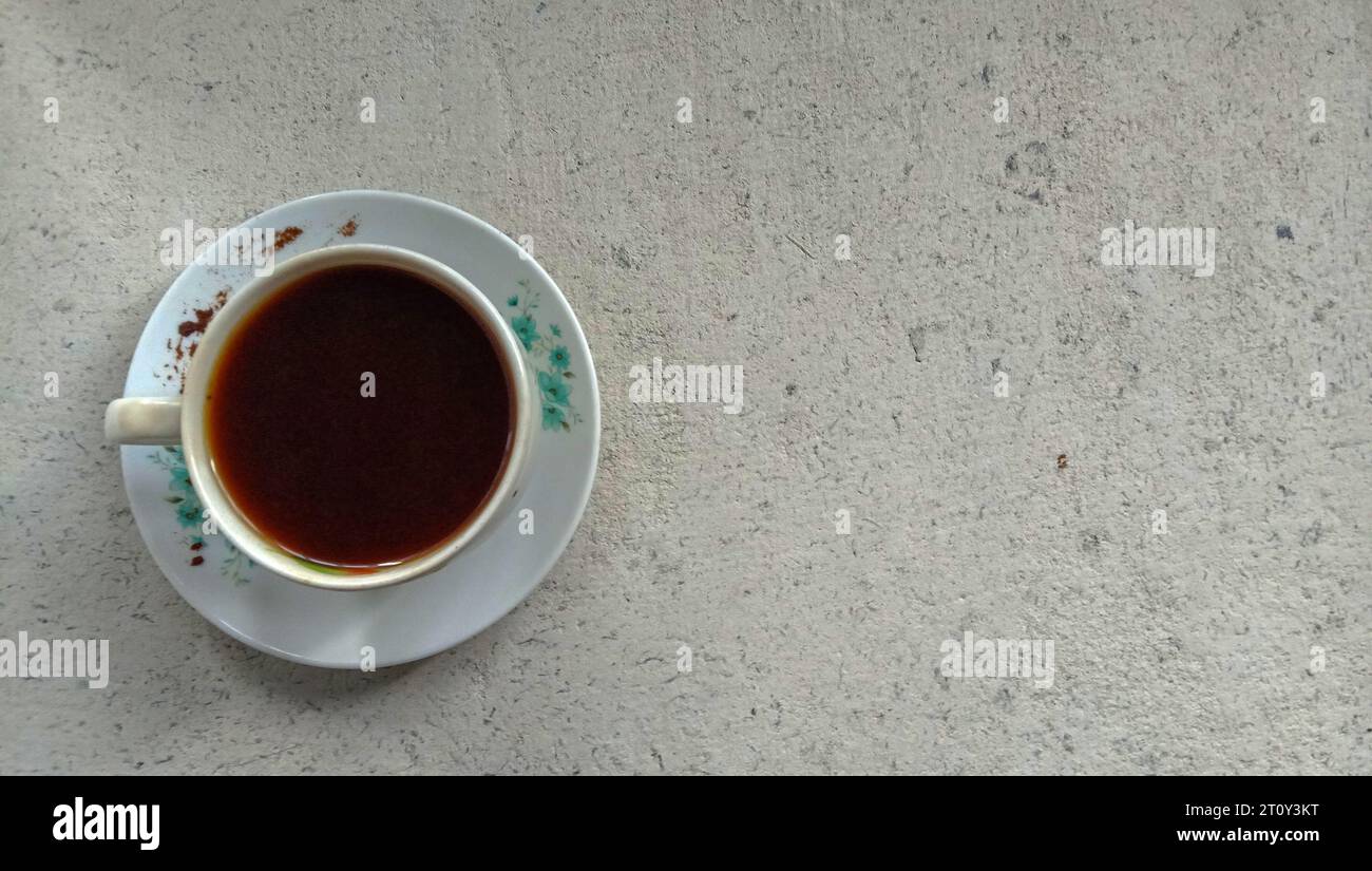 a photo of a cup of black coffee on a flat lay theme Stock Photo
