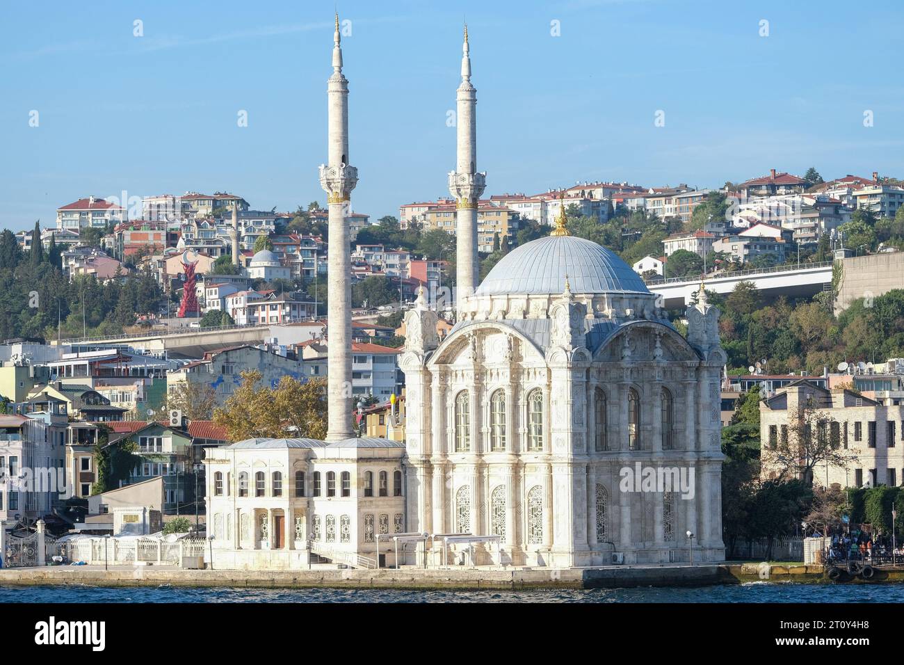 Ortakoy Mosque view from the sea in Istanbul. Religious mosque Ramadan month concept with building background. Stock Photo