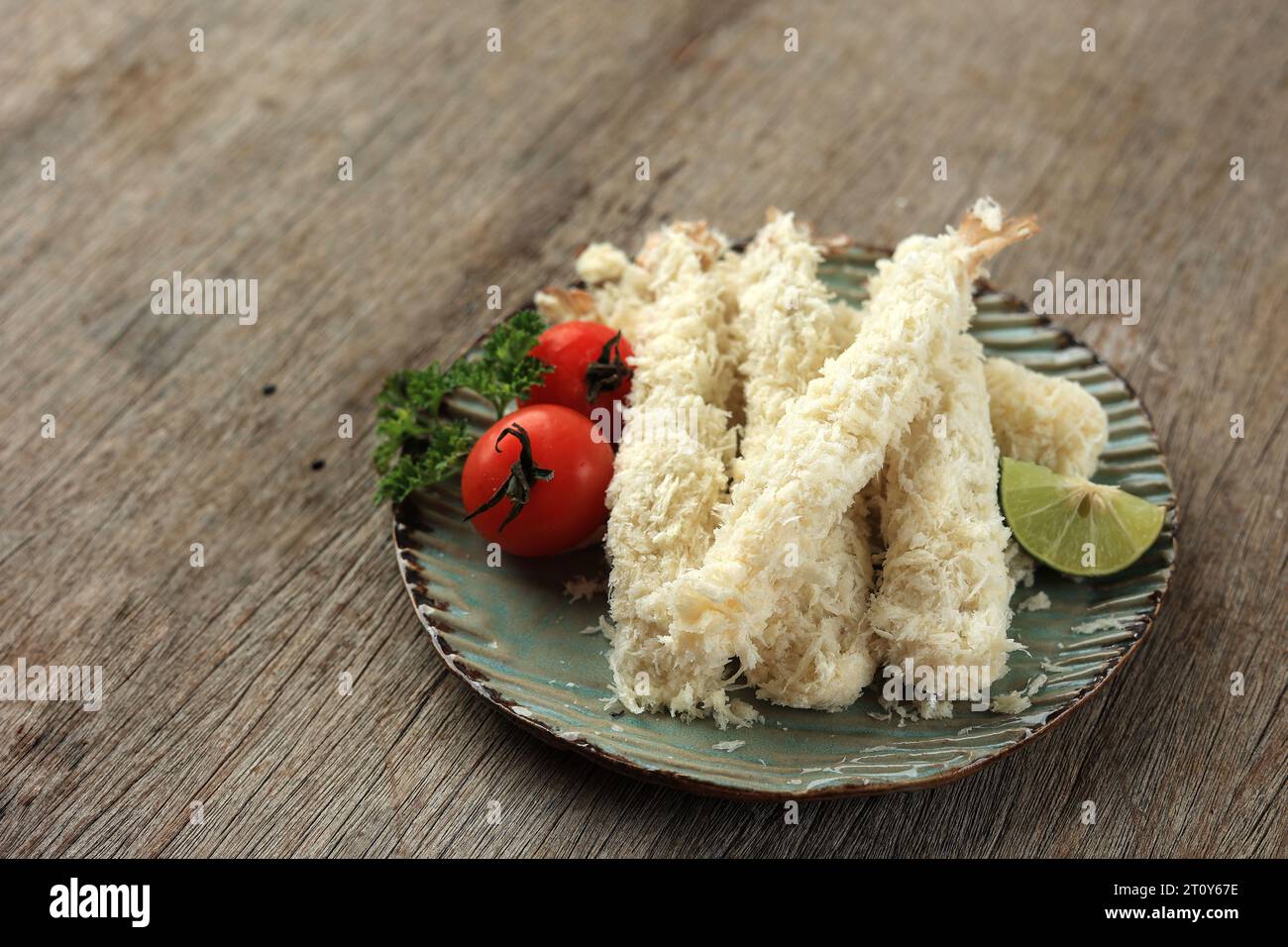 Raw Tempura Shrimps Ebi Furai in Breaded Flour, on Rustic Plate. Before