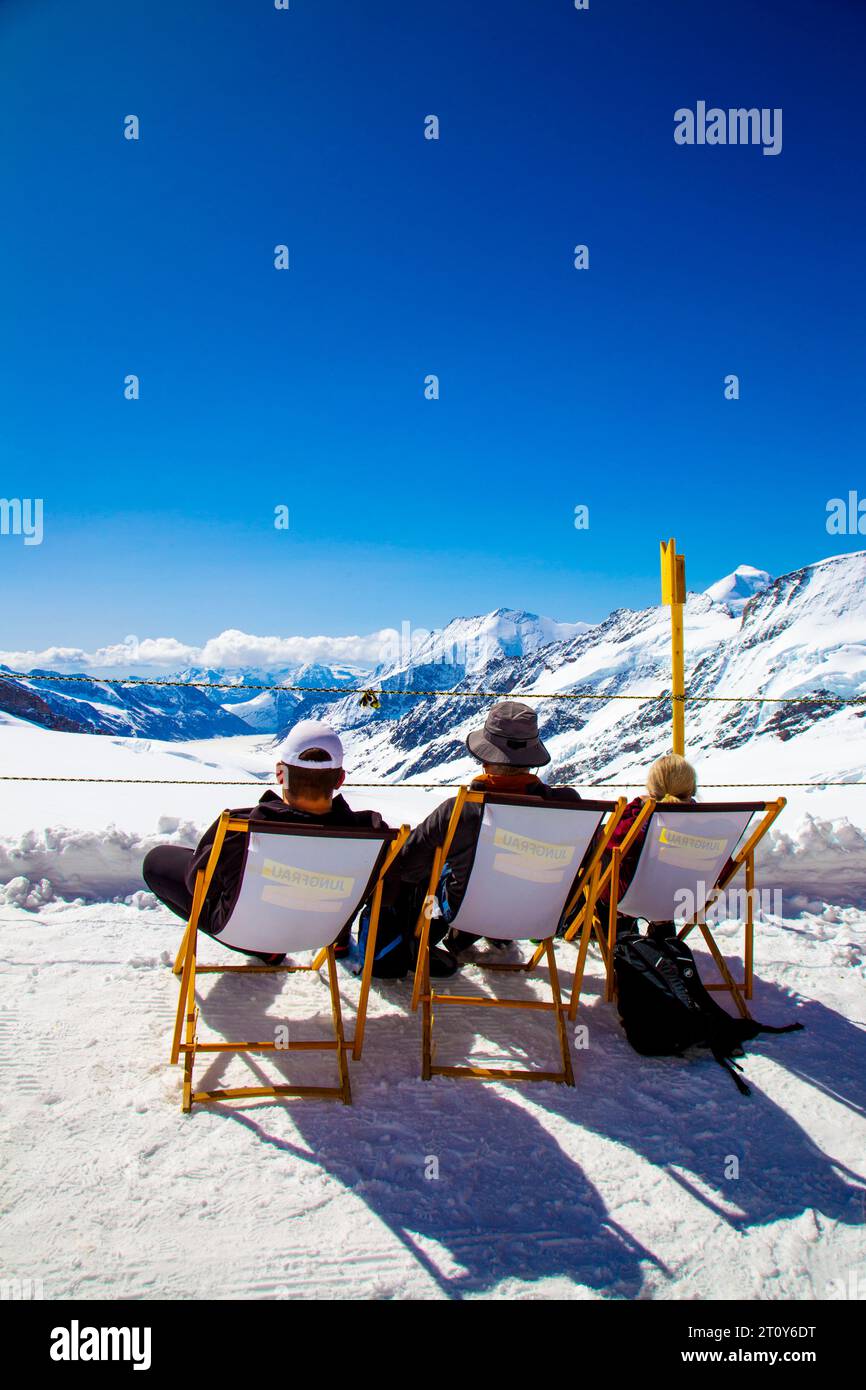 People relaxing in the mountains at Snow Fun Park Jungfraujoch, top of Jungfrau mountain, Swiss Alps, Switzerland Stock Photo