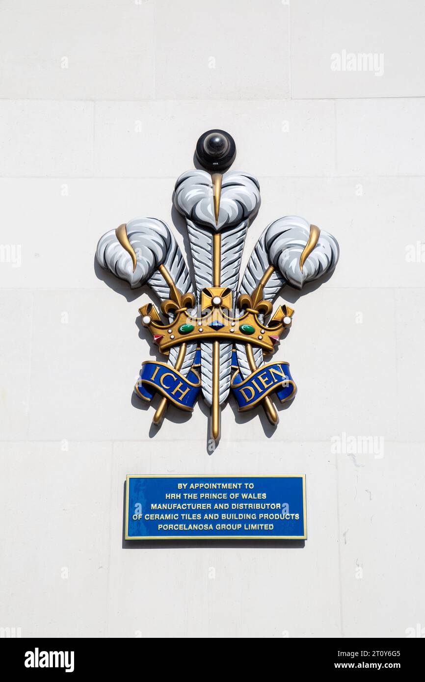 Heraldic Badge, Royal Insignia of Prince Charles The Prince of Wales on the wall Porcelanosa Hanover Square, London, UK Stock Photo