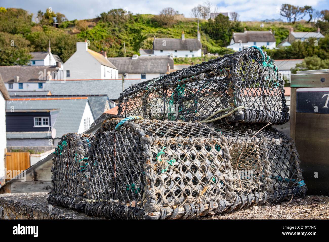 Lobster pots crabbing pots on shore in the Cornish village of Cadgwith, Cornwall,England,UK,2023