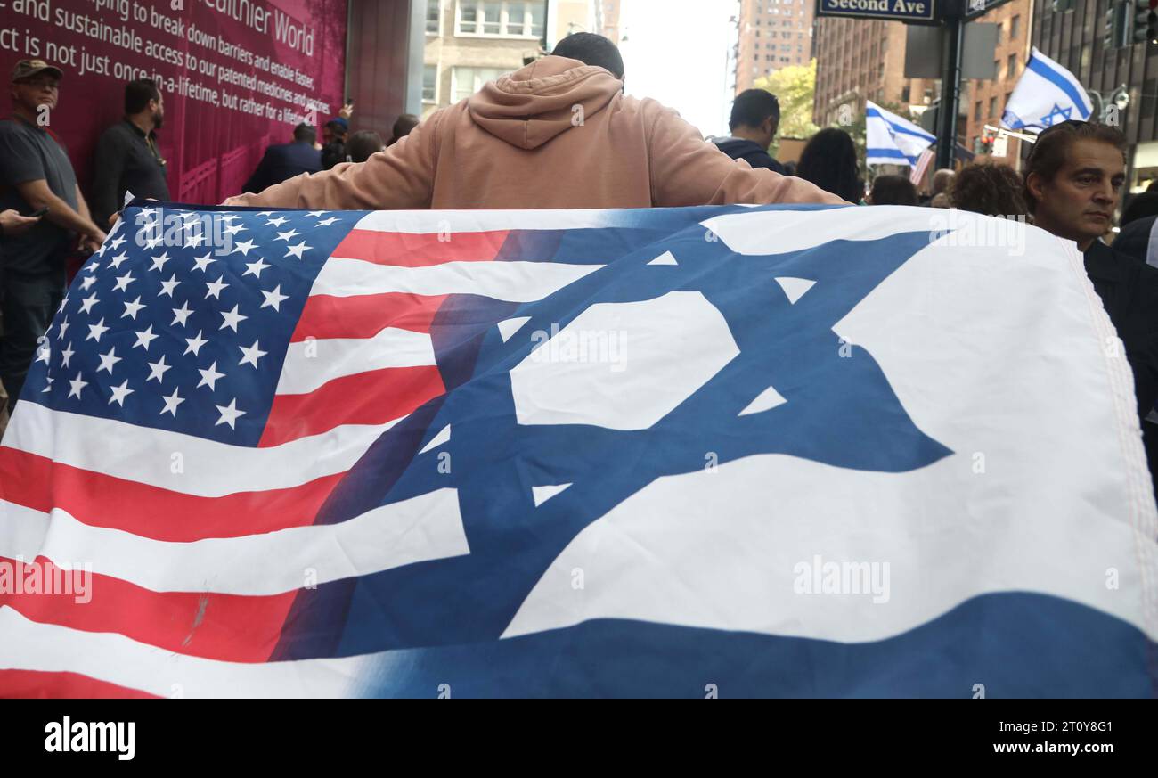 New York, New York, USA. 9th Oct, 2023. Pro Israeli supporter holds an American Israeli flag seen at a rally held in solidarity after the murderous attacks in Israel, near the Consulate General of Israel in Midtown, NYC. (Credit Image: © Nancy Kaszerman/ZUMA Press Wire) EDITORIAL USAGE ONLY! Not for Commercial USAGE! Credit: ZUMA Press, Inc./Alamy Live News Stock Photo