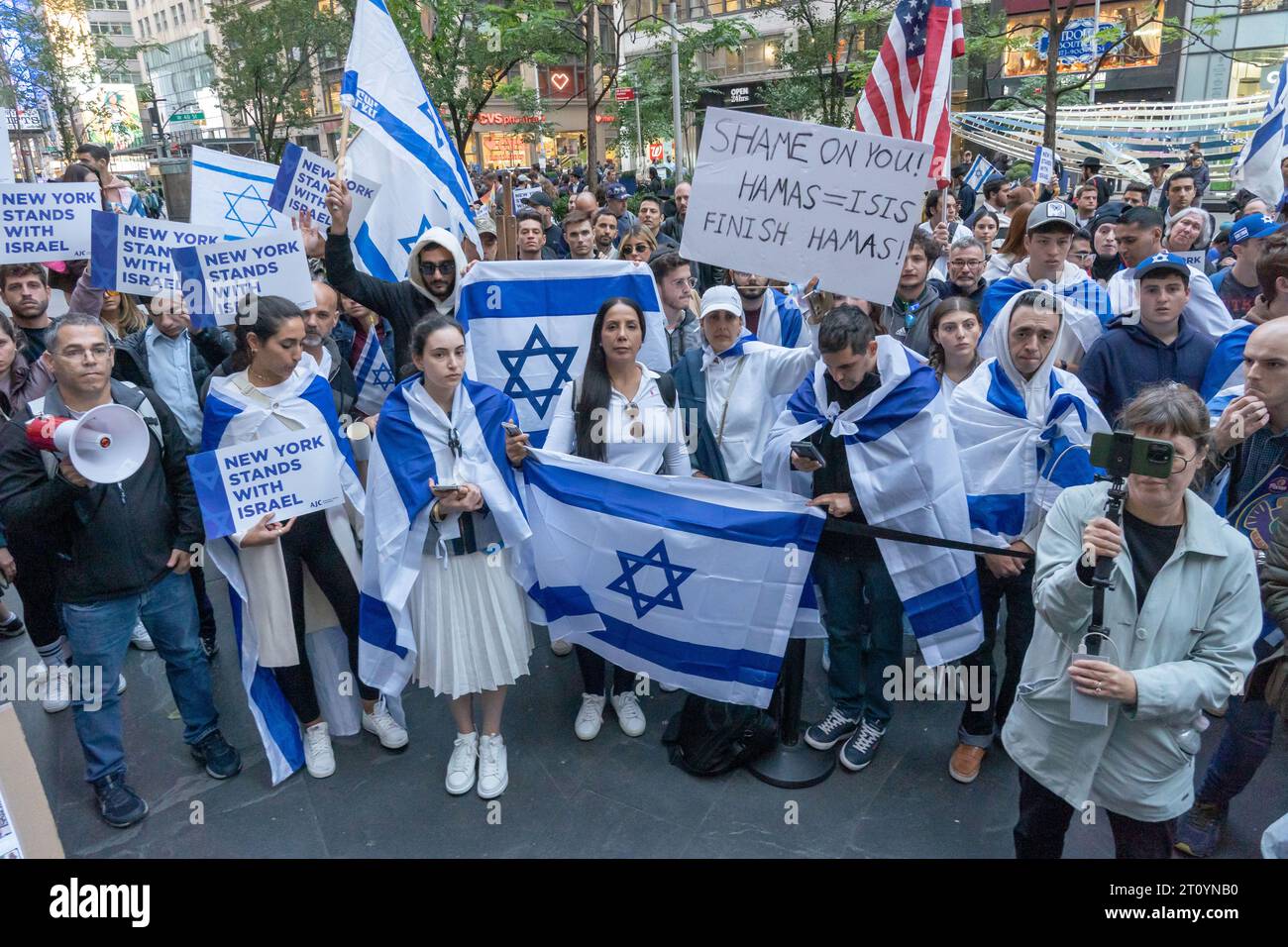 New York, USA. 09th Oct, 2023. Supporters of Israel with Israeli flags, American flags and signs rally at a Candlelight Vigil for Victims of Terrorist Attacks in Israel at Manhattan's Golda Meir Square on October 9, 2023 in New York City. On October 7, the Palestinian militant group Hamas launched a surprise attack on Israel from Gaza by land, sea, and air, killing over 900 people and wounding more than 2000. According to reports, 130 Israeli soldiers and civilians have also been kidnapped by Hamas and taken into Gaza. Credit: Ron Adar/Alamy Live News Stock Photo