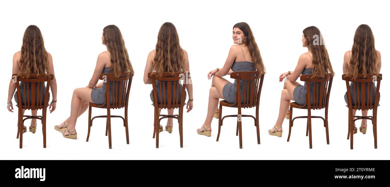 back viw of group of same young gril sitting on chair and turned and looking at camera  on white background Stock Photo