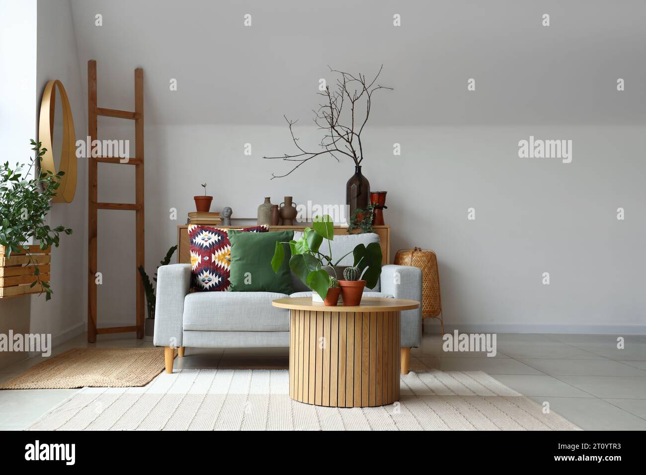 Interior of living room with coffee table and sofa Stock Photo - Alamy