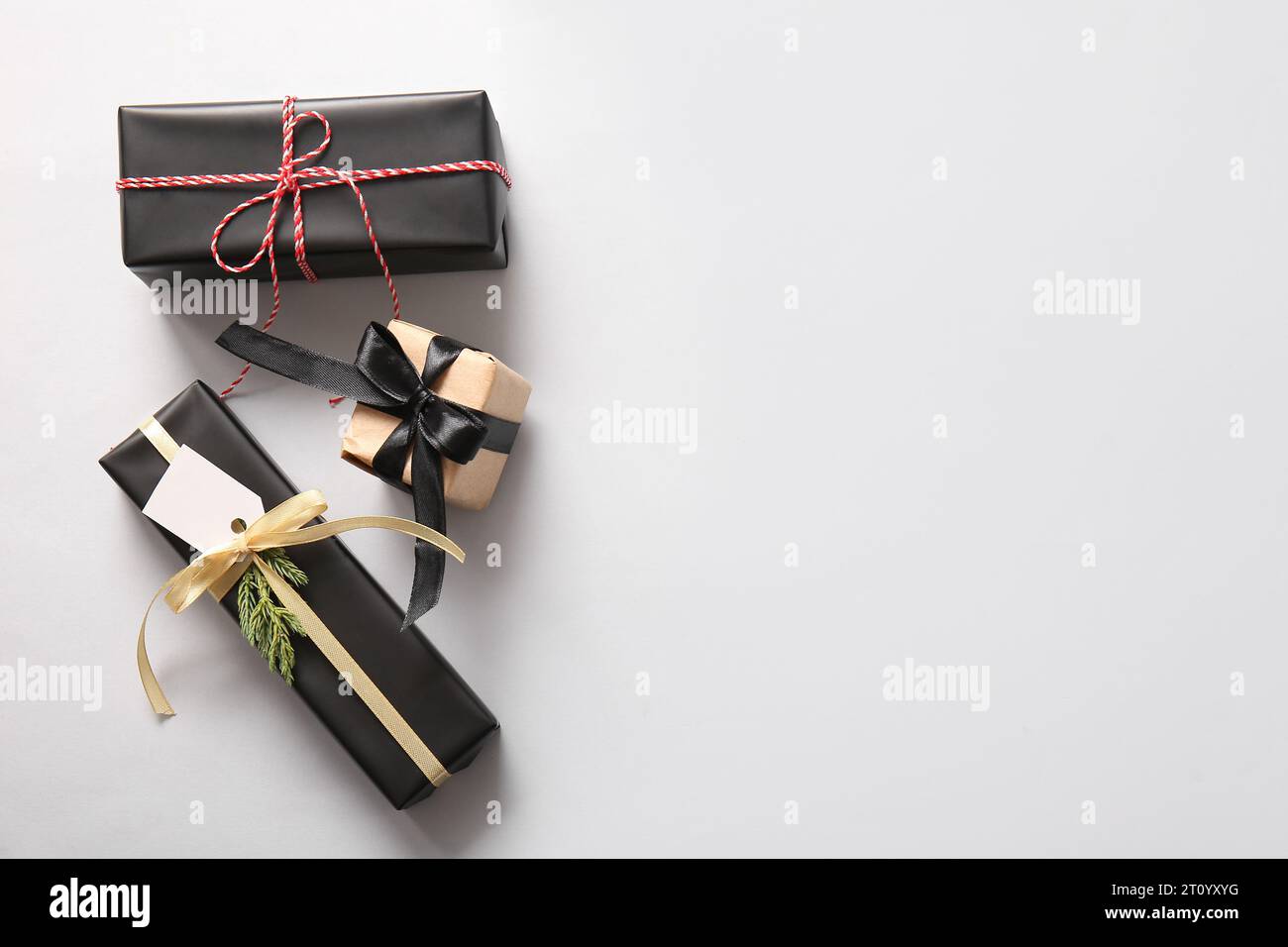 Gift boxes and Christmas tree branch on white background Stock Photo ...