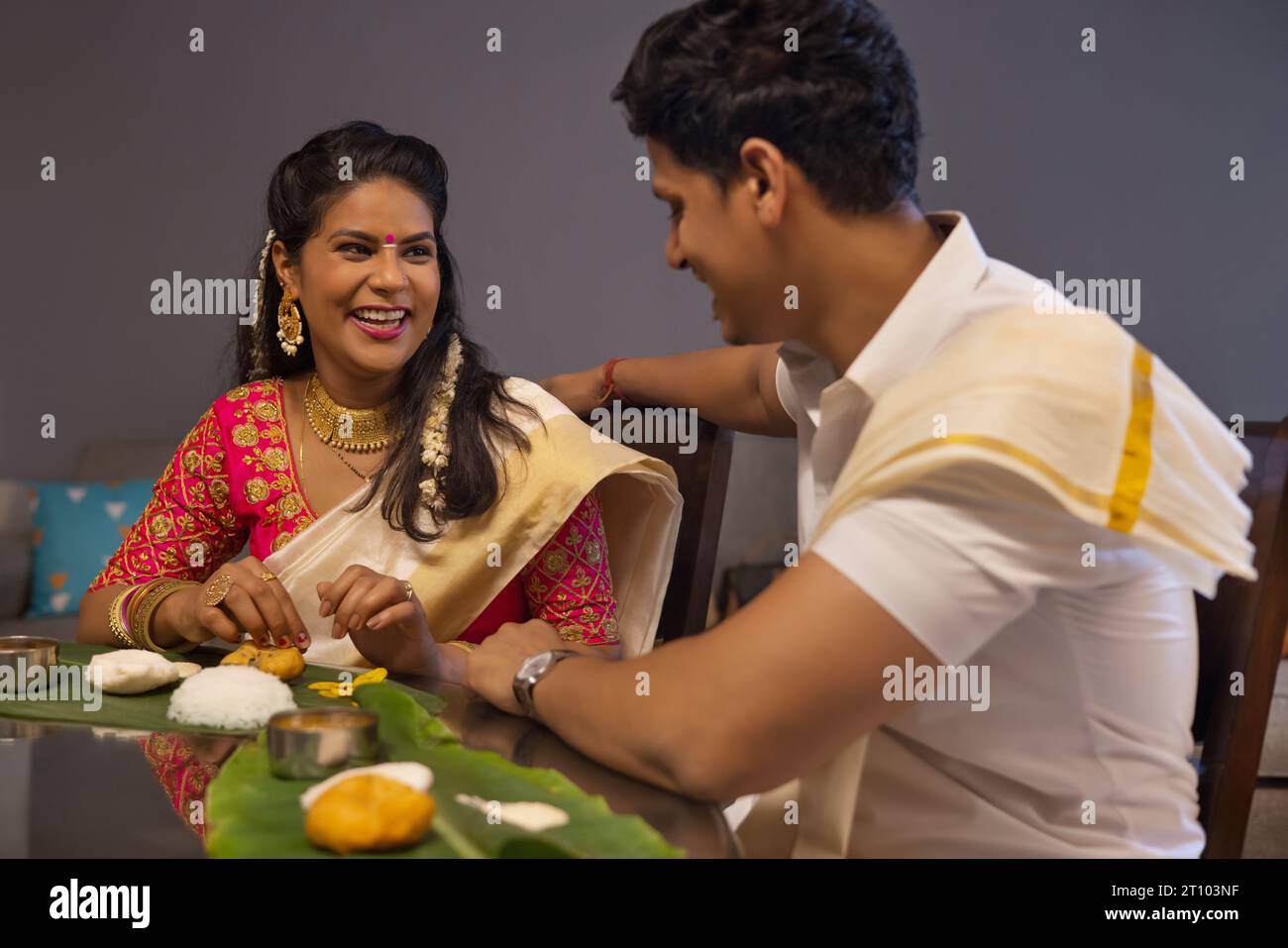 Happy couple having Onam Sadhya together at home Stock Photo