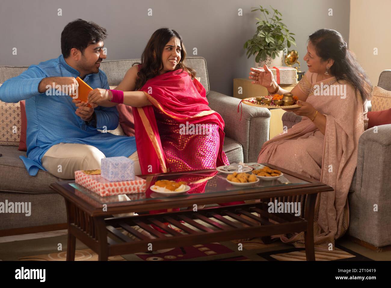 Happy Indian family celebrating Raksha Bandhan Stock Photo