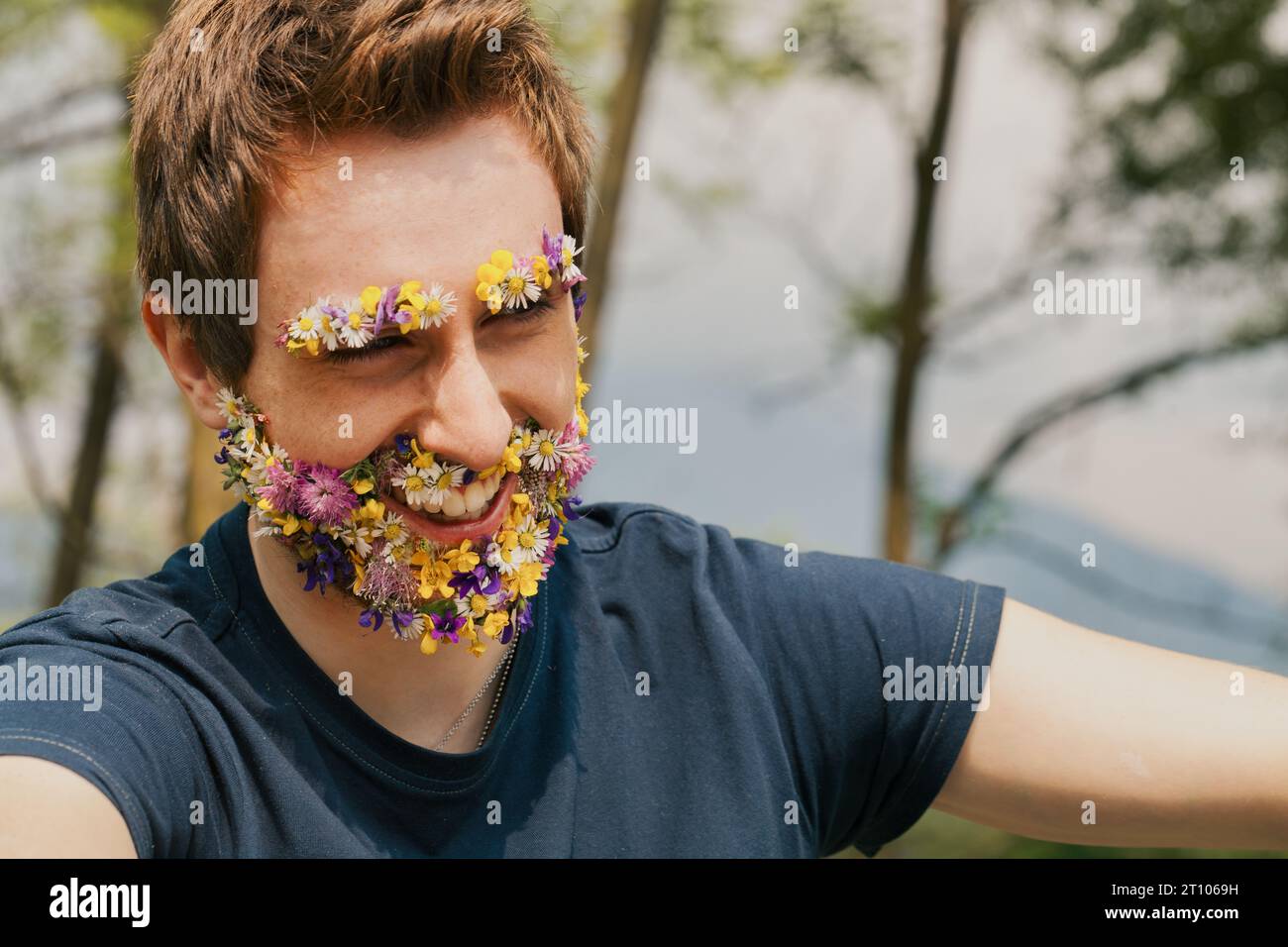 Amidst green, a redhead's unique feature a face blooming with flowers
