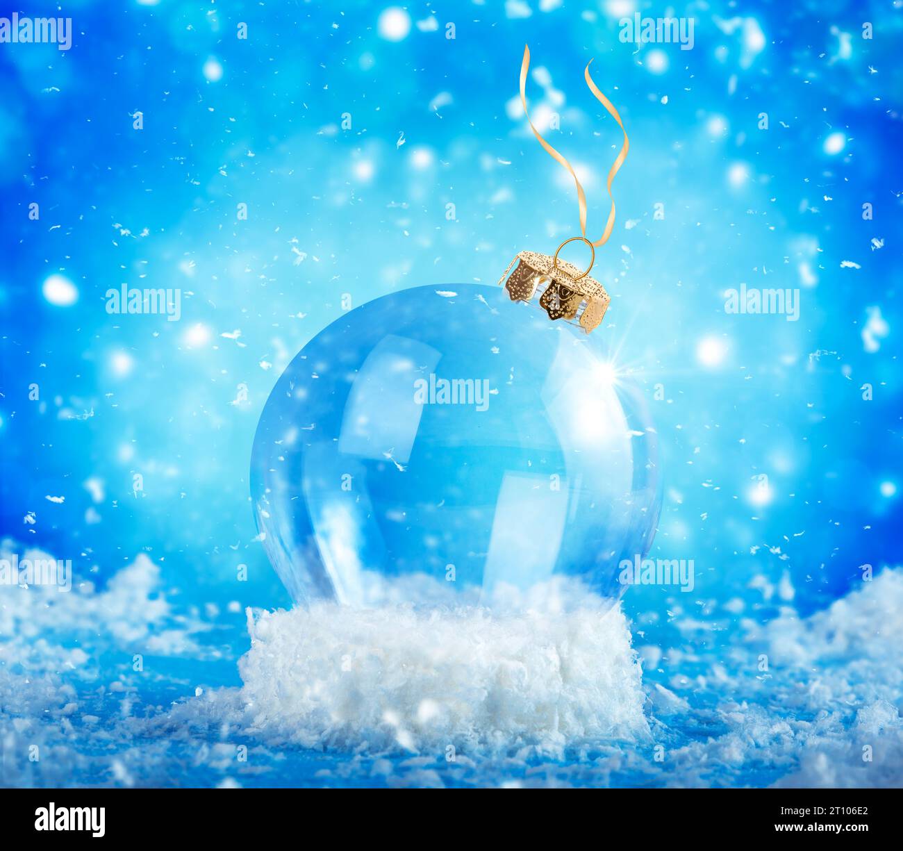 Christmas ornament, snow globe on blue snowing background. Stock Photo