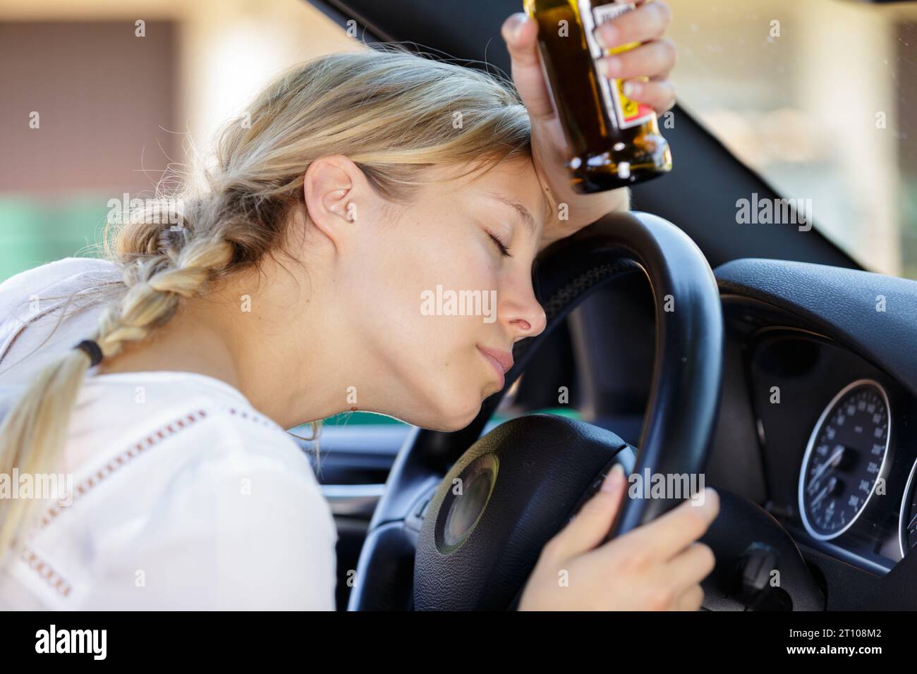 woman sleeping after drinking alcohol while driving Stock Photo Alamy