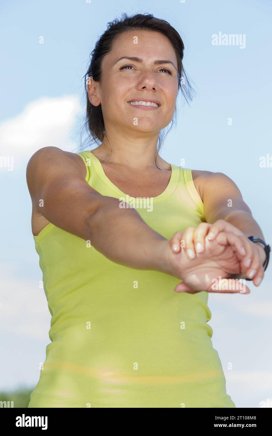 woman stretching arms before exercise Stock Photo - Alamy