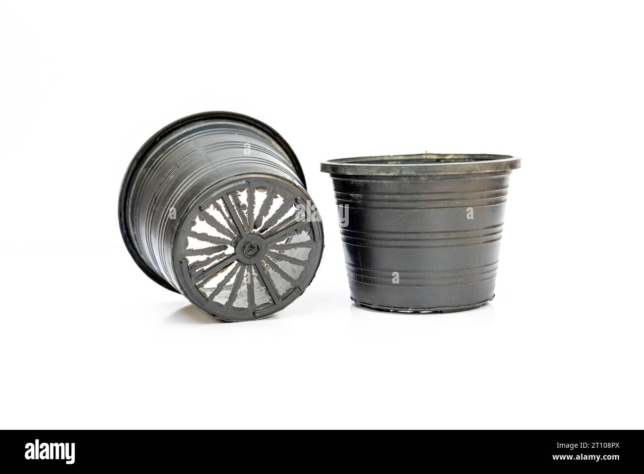 Black plastic pots for plants isolated on white background Stock Photo