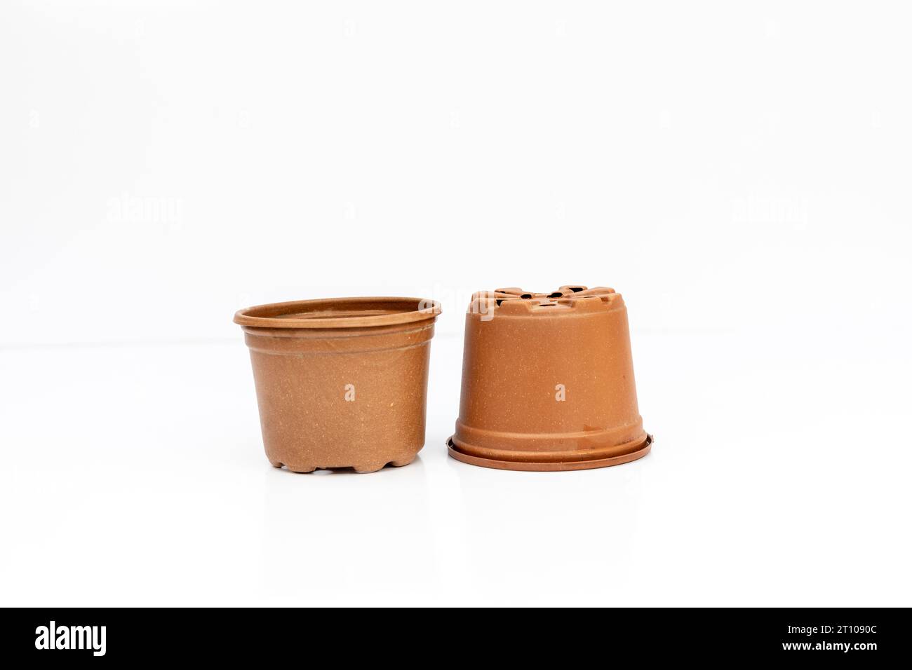 Flexible plastic pots for seedlings isolated o white background Stock Photo
