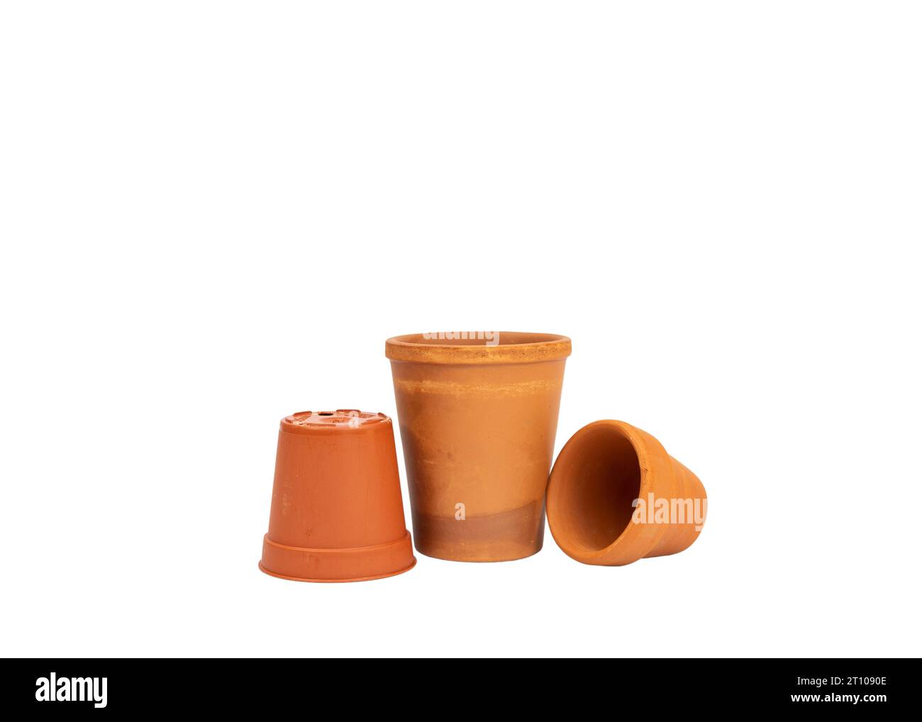Empty small terracotta plant pot isolated on a white background. Stock Photo