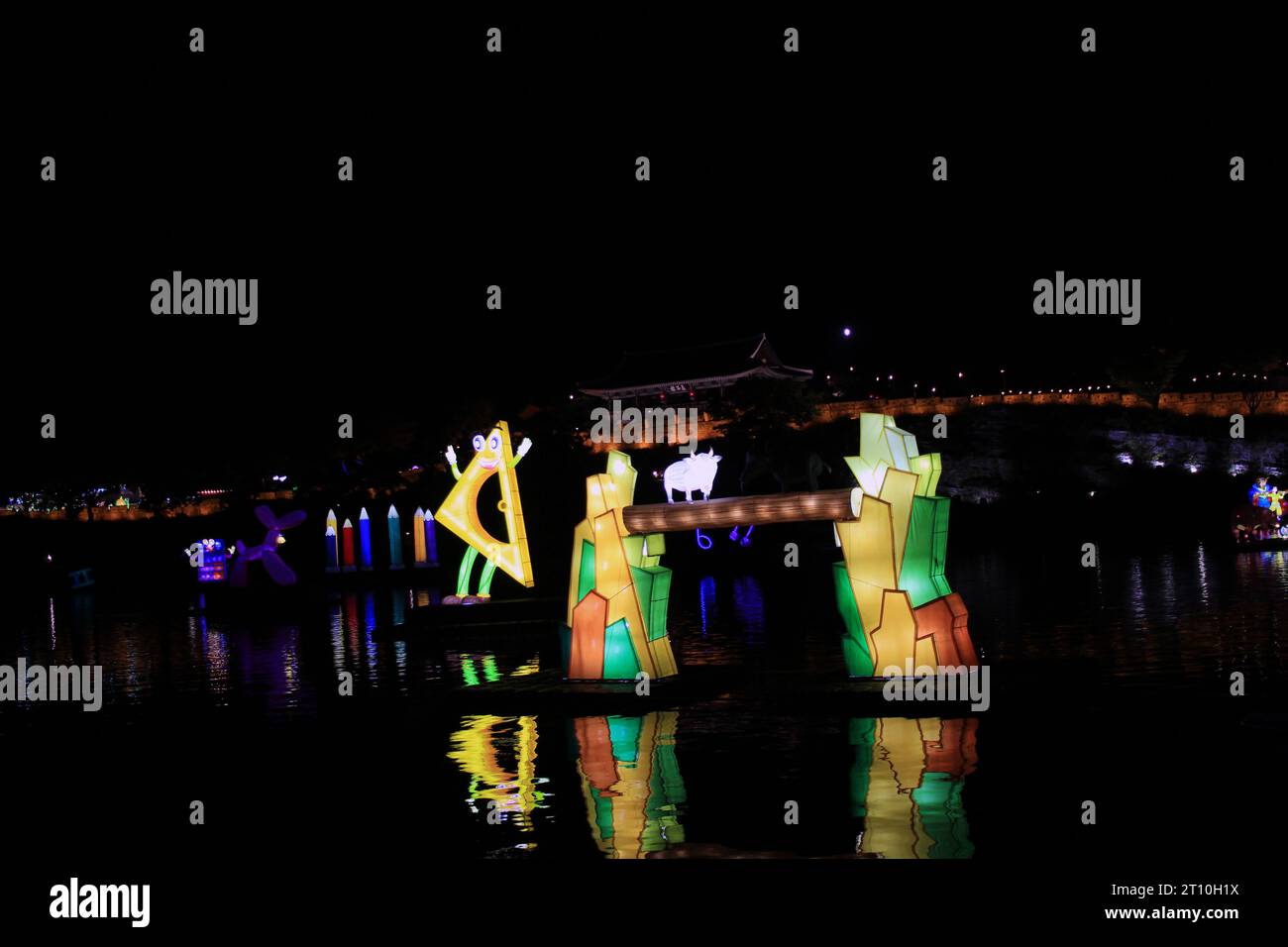 Jinju City, Gyeongsangnam-do Republic of Korea October 9, 2023: The colorful lights of the Namgang Yudeung Festival with a view of Jinju Castle and th Stock Photo