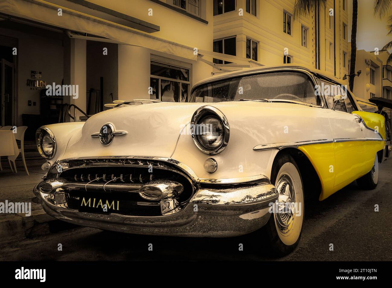 Oldsmobile 88 Automobile, two-door holiday coupe, circa 1955, yellow & cream, Ocean Drive. Miami Beach Stock Photo