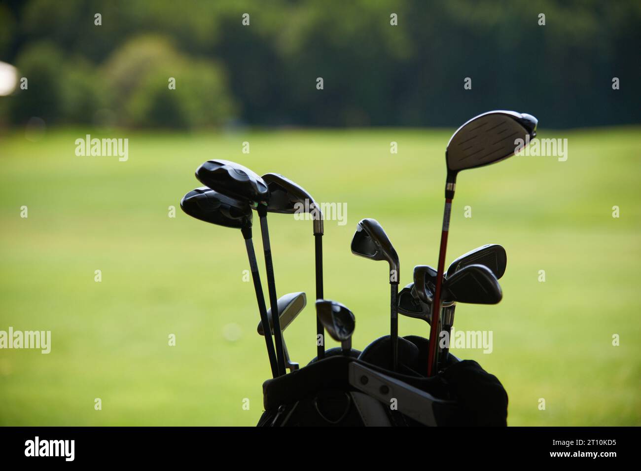 golf clubs on the background of a green lawn close up Stock Photo