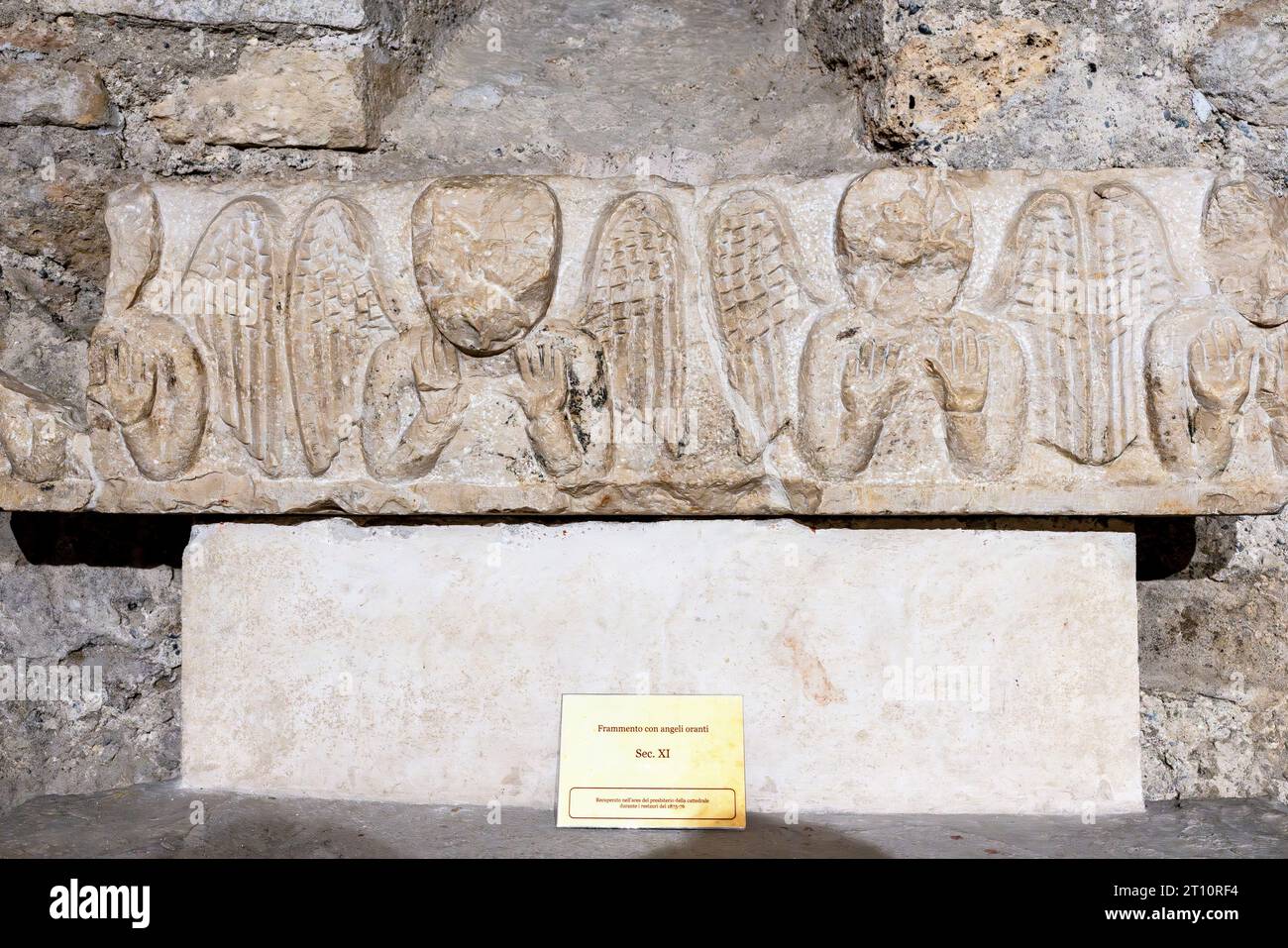 Fragment with decorative angels dating from the 11th century exhibited inside the crypt below the Ventimiglia cathedral,  Liguria, Italy. Stock Photo