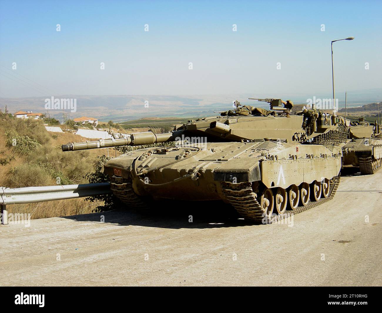 14th August 2006 The Israel-Hezbollah War 2006. After a ceasefire was announced at 08:00, Israeli Merkava 3 (Chariot) tanks are parked on the main road between Kfar Blum and Metula in the north-east of Israel. Stock Photo